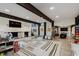Expansive playroom with a fireplace, large windows, and plenty of space for educational and recreational activities at 1616 W 116Th St, Carmel, IN 46032