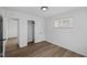 Neat bedroom showing closet with hanging bar, white trim and neutral walls at 1730 S State Ave, Indianapolis, IN 46203