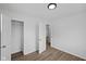 Open bedroom with closet view and laminate floors at 1730 S State Ave, Indianapolis, IN 46203