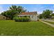 Charming home with a well-manicured front yard, lush greenery, and inviting curb appeal at 1730 S State Ave, Indianapolis, IN 46203