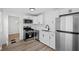 Updated kitchen with modern appliances, white cabinets, and subway tile backsplash at 1730 S State Ave, Indianapolis, IN 46203