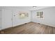 Bright living room with hardwood floors, natural light, and fresh, neutral paint at 1730 S State Ave, Indianapolis, IN 46203
