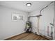 Utility room featuring a water heater and laminate flooring at 1730 S State Ave, Indianapolis, IN 46203