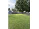 Large backyard with a storage shed and a charming fire pit area, ideal for outdoor enjoyment at 174 Jordan Dr, Franklin, IN 46131
