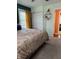 Bedroom features a view of the closet, and a peek into an adjacent space with hardwood floors at 174 Jordan Dr, Franklin, IN 46131
