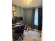 This is a home office space featuring a large screen monitor and neutral toned walls and plush carpeting at 174 Jordan Dr, Franklin, IN 46131