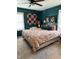 Bright bedroom with large patterned bed, colorful pillows, and natural light from two windows at 174 Jordan Dr, Franklin, IN 46131