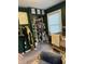 Bedroom showcases a closet, a baby's crib, and olive green colored walls at 174 Jordan Dr, Franklin, IN 46131