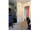 This bedroom space showcases an open doorway, leading into another room with a tiled floor at 174 Jordan Dr, Franklin, IN 46131