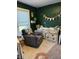 Cozy Bedroom corner features a dresser with changing station, chair, and decorative wall accents at 174 Jordan Dr, Franklin, IN 46131