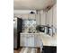Well-maintained kitchen with gray cabinetry, tiled backsplash, stainless steel refrigerator and neutral countertops at 174 Jordan Dr, Franklin, IN 46131