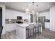 Beautiful kitchen with white cabinetry, stainless steel appliances, granite countertops, and bar stool seating at 18980 Seaforth Way, Westfield, IN 46074