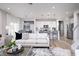 Open concept living room with view to kitchen, stainless appliances, and breakfast bar at 18980 Seaforth Way, Westfield, IN 46074