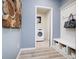 Well-organized mudroom with bench seating and laundry area at 18980 Seaforth Way, Westfield, IN 46074