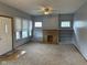 Cozy living room featuring a decorative fireplace and large windows for ample lighting at 1902 Westview Dr, Indianapolis, IN 46221