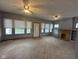 Spacious living room with a fireplace, built-in shelves, and natural light at 1902 Westview Dr, Indianapolis, IN 46221