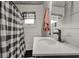 Modern farmhouse bathroom with white shiplap walls, vessel sink, and black and white accents at 1927 N Cherry St, Columbus, IN 47201