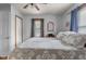 Bedroom featuring a queen-size bed, closet, hardwood floors, and natural light at 1927 N Cherry St, Columbus, IN 47201
