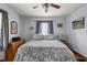 Cozy bedroom with a queen-size bed, hardwood floors, and neutral-toned walls and decor at 1927 N Cherry St, Columbus, IN 47201