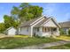 Charming single-Gathering home with a well-maintained lawn, inviting front porch, and detached garage at 1927 N Cherry St, Columbus, IN 47201