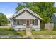 Attractive home featuring a red front door, brick accents, and a cozy porch area at 1927 N Cherry St, Columbus, IN 47201