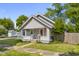 Charming single-story home features a covered porch and a well-maintained front lawn at 1927 N Cherry St, Columbus, IN 47201