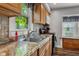 Close-up of the kitchen featuring a stainless steel sink, updated countertops, and modern appliances at 1927 N Cherry St, Columbus, IN 47201