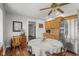 Eat-in kitchen with stainless steel refrigerator and wood cabinetry and a dining table with four chairs at 1927 N Cherry St, Columbus, IN 47201