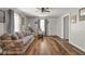 Bright living room with hardwood floors, a ceiling fan, and neutral wall paint at 1927 N Cherry St, Columbus, IN 47201