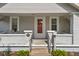 Inviting front porch featuring a red door, brick accents, and a welcoming entryway at 1927 N Cherry St, Columbus, IN 47201