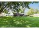 Lush backyard with expansive green space and tree coverage at 218 Narcissus Dr, Indianapolis, IN 46227