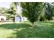 Spacious backyard featuring a shed and mature trees providing plenty of shade at 218 Narcissus Dr, Indianapolis, IN 46227