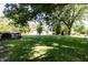 Large backyard with a wooden deck and plenty of green space at 218 Narcissus Dr, Indianapolis, IN 46227