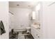 Bathroom featuring tub with shower, white vanity, toilet, and wood-look floor at 218 Narcissus Dr, Indianapolis, IN 46227