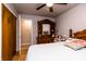 Bedroom featuring queen-size bed, wooden dresser, closet and ceiling fan with lights at 218 Narcissus Dr, Indianapolis, IN 46227