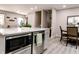Open concept dining area with a modern island, stainless steel microwave, and seating, ideal for Gathering meals at 218 Narcissus Dr, Indianapolis, IN 46227