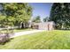 Charming home with brick facade, siding, driveway, well-maintained lawn, mature trees, and landscaping at 218 Narcissus Dr, Indianapolis, IN 46227