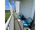 Relaxing back porch with outdoor seating overlooking the landscaped yard and pond at 2485 Blue Ridge Dr, Greenwood, IN 46143