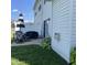 Backyard patio features a grill, dining set and partially fenced area at 2485 Blue Ridge Dr, Greenwood, IN 46143