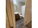 Hall bathroom with vinyl flooring, single vanity, and shower/tub combo at 2485 Blue Ridge Dr, Greenwood, IN 46143