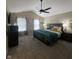 Spacious bedroom with ceiling fan, carpeted floors, and natural light at 2485 Blue Ridge Dr, Greenwood, IN 46143