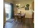 Bright dining area with hardwood floors, sliding glass doors, and a charming dining table at 2485 Blue Ridge Dr, Greenwood, IN 46143