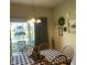 Dining room with sliding glass doors leading to a patio and a black and white checkered tablecloth at 2485 Blue Ridge Dr, Greenwood, IN 46143