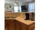 Kitchen with stainless steel sink, light countertops, and view into the adjacent living space at 2485 Blue Ridge Dr, Greenwood, IN 46143