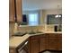 Kitchen with stainless steel dishwasher, light countertops, and view into the adjacent living space at 2485 Blue Ridge Dr, Greenwood, IN 46143