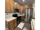 Kitchen with stainless steel appliances, dark hardwood flooring, and light countertops at 2485 Blue Ridge Dr, Greenwood, IN 46143