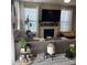 Cozy living room featuring a fireplace, large windows, and comfortable seating at 2485 Blue Ridge Dr, Greenwood, IN 46143