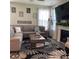Cozy living room featuring a fireplace, large windows, and comfortable sectional sofa at 2485 Blue Ridge Dr, Greenwood, IN 46143