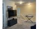 Carpeted loft with TV console, keyboard, and railing overlooking the staircase at 2485 Blue Ridge Dr, Greenwood, IN 46143
