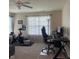 Home office with cycling machine, desk, and large window at 2485 Blue Ridge Dr, Greenwood, IN 46143
